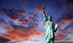Statue of Liberty with Red and Blue Sunset Sky